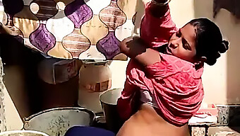 Mom'S Little Helper: Aging Indian Woman Takes A Bath Outdoors