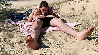 Nude Couple Enjoys Public Blowjob On The Beach